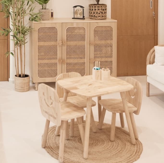 Bright, minimalist play area with natural wood furniture