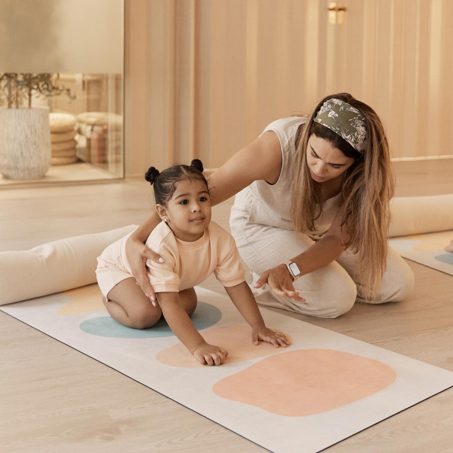 Bright, minimalist play area with natural wood furniture